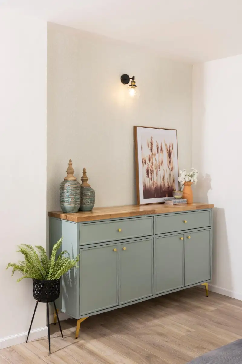 Console styled with ceramics and a framed print
